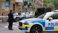 A street is barricaded by a police car in Sweden