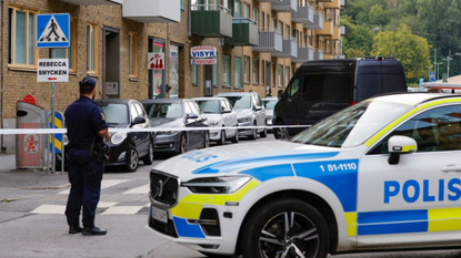 A street is barricaded by a police car in Sweden