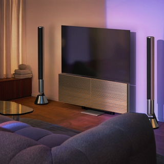 Beovision Harmony TV by Bang and Olufsen in a purple-lit room