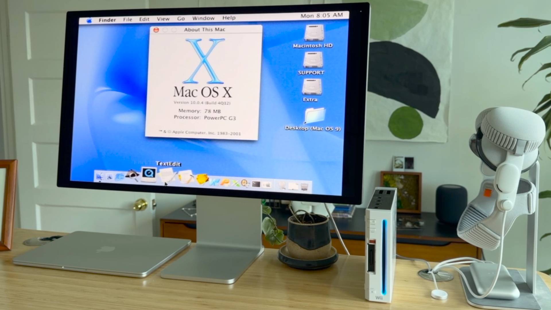 Desktop with Nintendo Wii plugged into monitor running Mac OS X with desktop on screen.