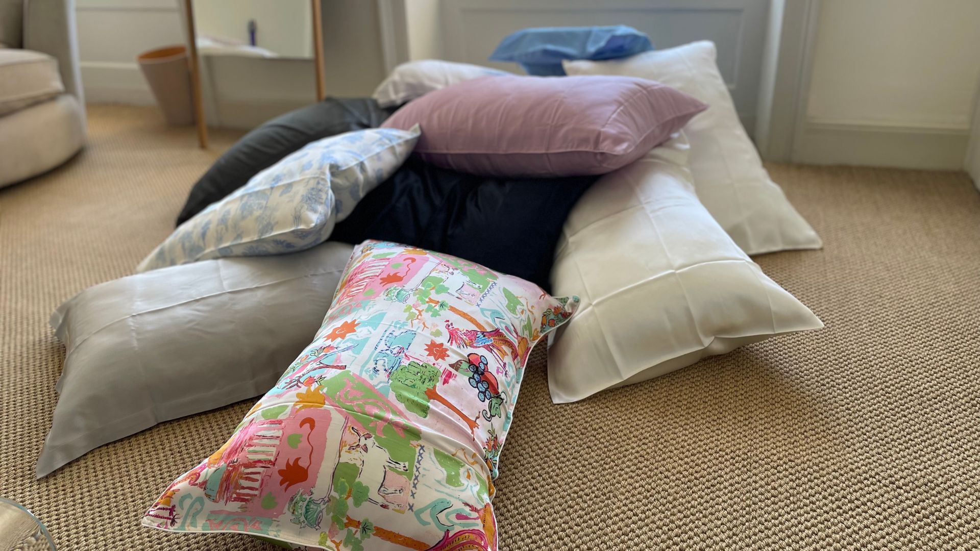 Testing the best silk pillowcases - stacked on the floor