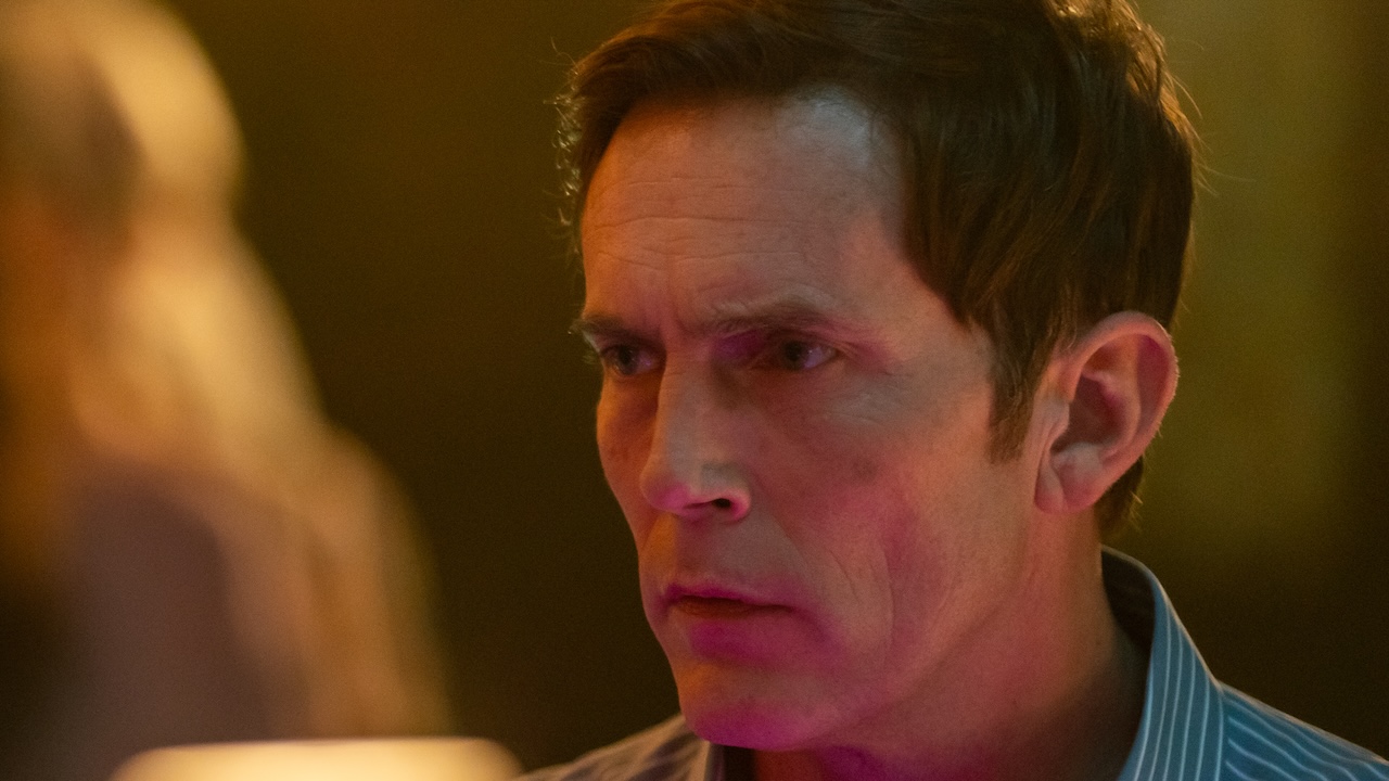 Close-up on Quinn sitting in bar in Dexter: Resurrection Season 1