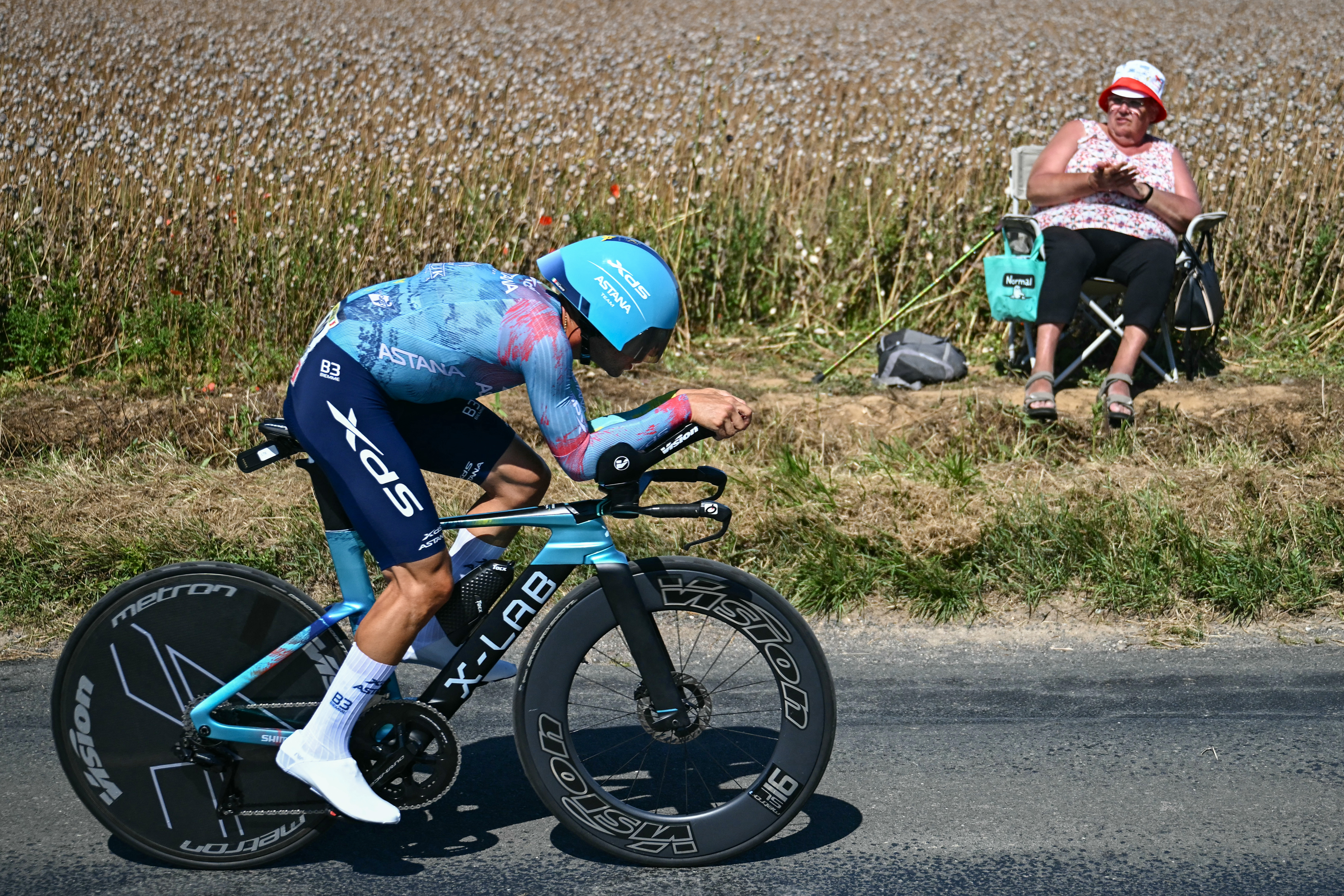 XDS Astana Team&#039;s Italian rider Simone Velasco cycles during the 5th stage of the 112th edition of the Tour de France cycling race, 33 km individual time trial starting and finishing in Caen, northwestern France, on July 9, 2025. (Photo by Loic VENANCE / AFP)