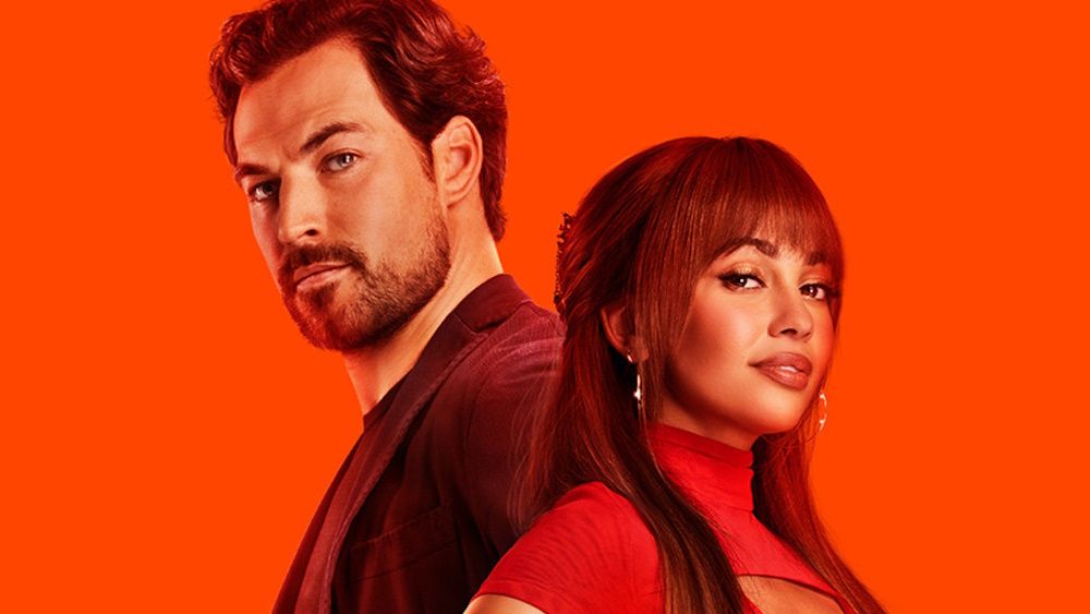 Giacomo Gianniotti and Vanessa Morgan posing in a promotional poster for &quot;Wild Cards&quot;