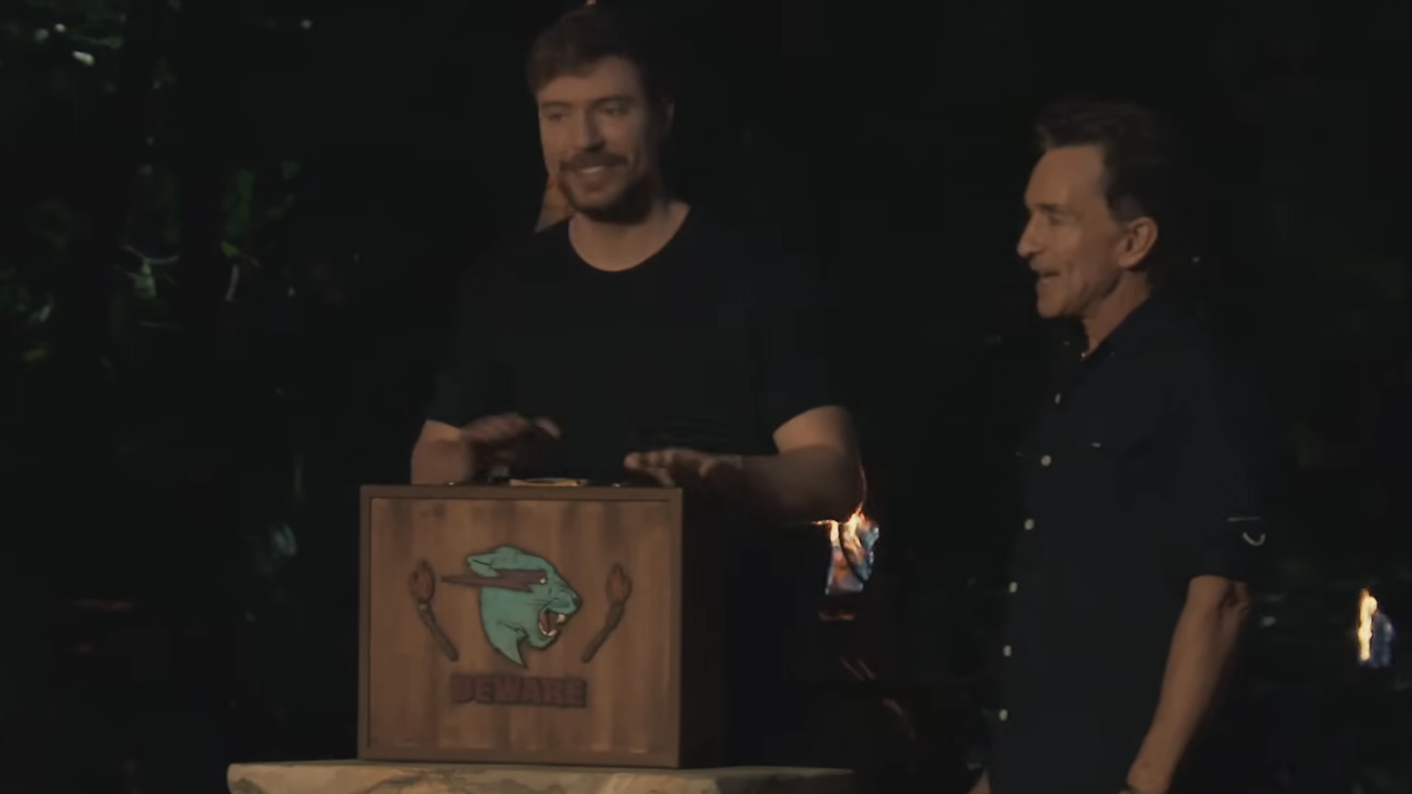 MrBeast holding his briefcase at Tribal with Jeff Probst on Survivor 50.