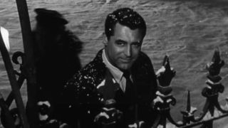 Cary Grant smiling in the snow in The Bishop's Wife