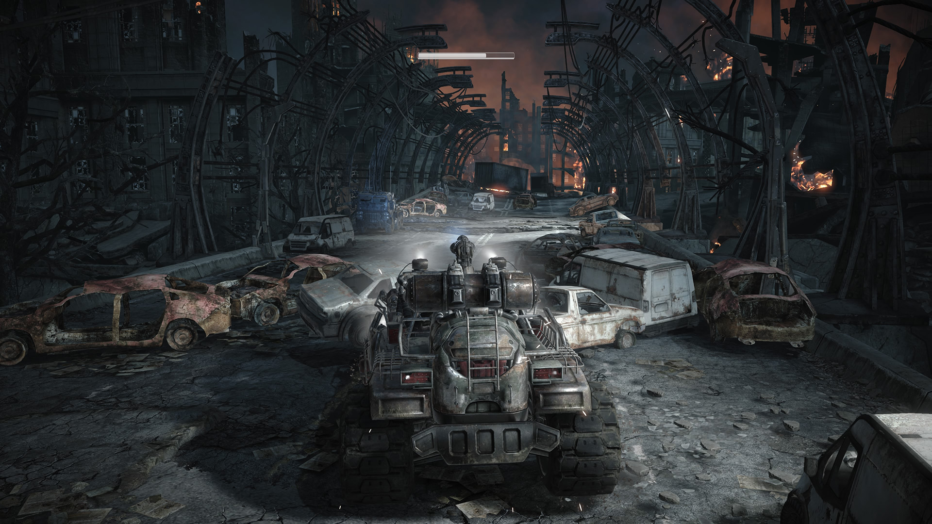The Gears drive a big truck through a skeletal-y industrial highway in Gears of War: Reloaded