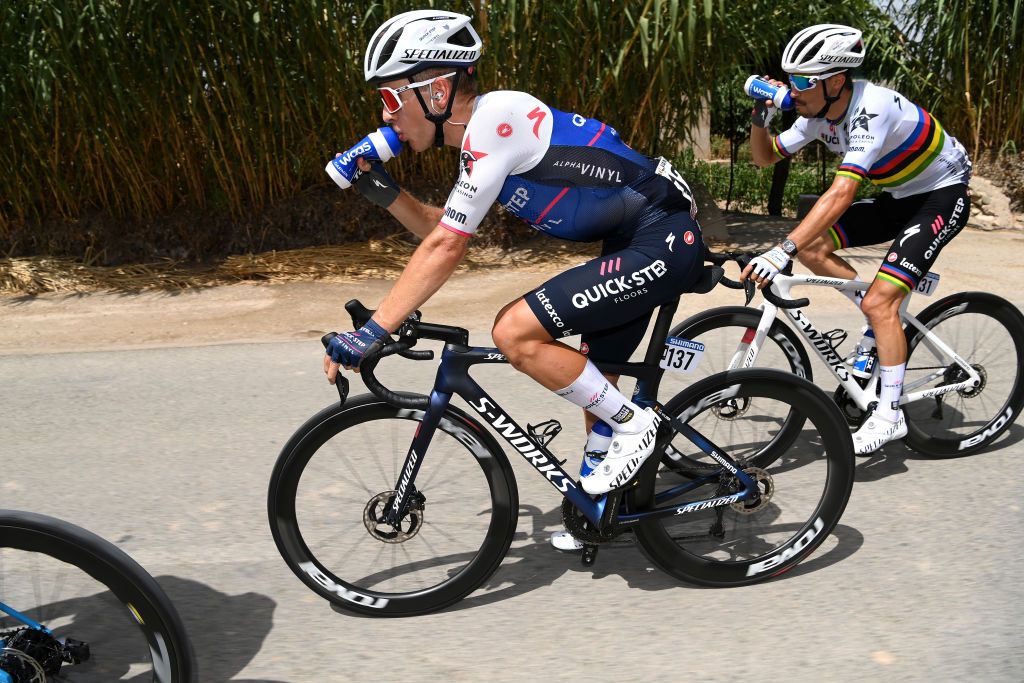 CABO DE GATA SPAIN AUGUST 31 LR Ilan Van Wilder of Belgium and Julian Alaphilippe of France and Team QuickStep Alpha Vinyl compete during the 77th Tour of Spain 2022 Stage 11 a 1912km stage from ElPozo Alimentacin Alhama de Murcia to Cabo de Gata LaVuelta22 WorldTour on August 31 2022 in Cabo de Gata Spain Photo by Justin SetterfieldGetty Images