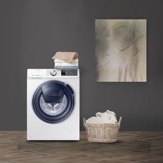dark grey wall with washing machine and basket