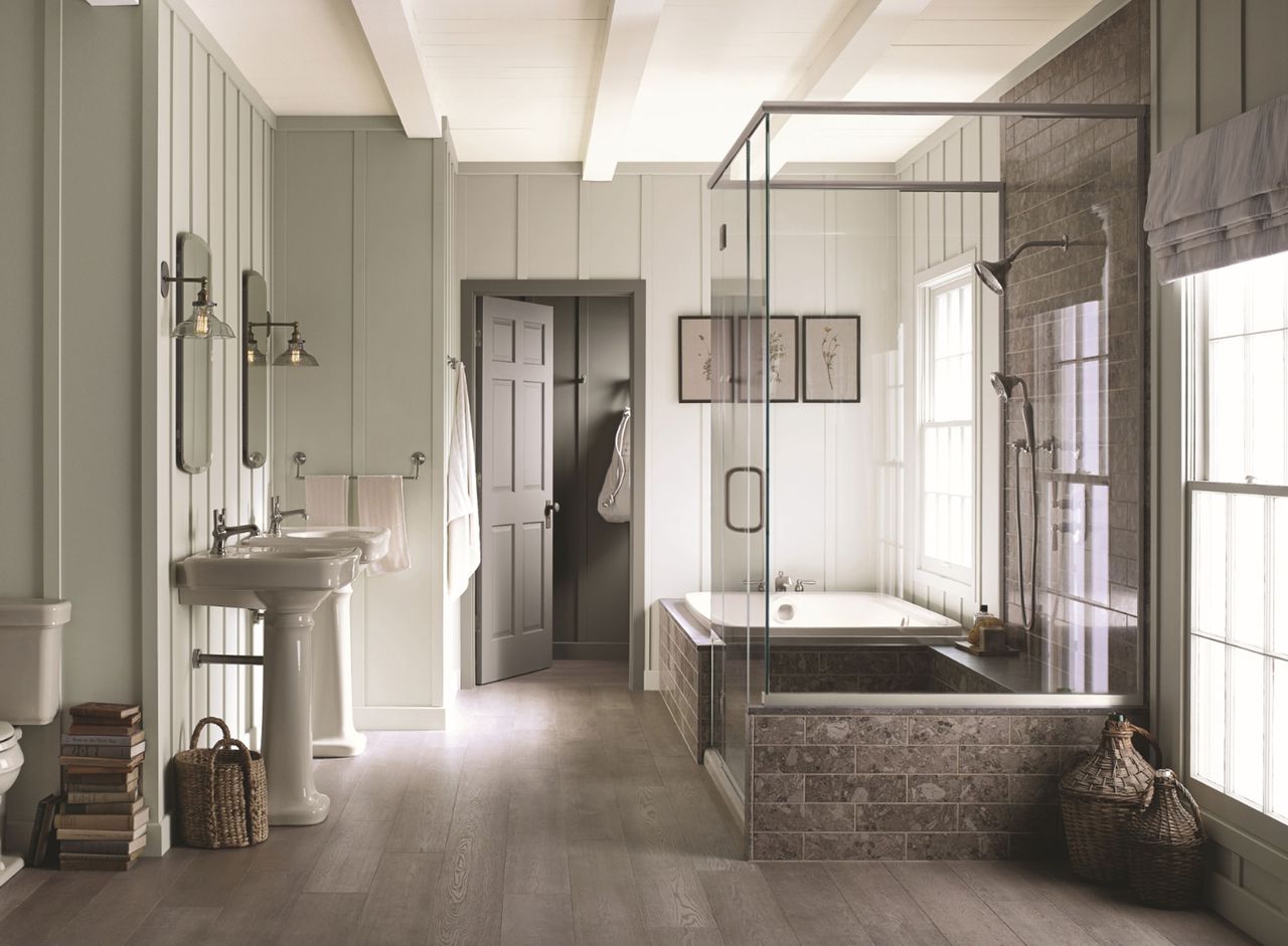 a modern bathroom with traditional paneled walls