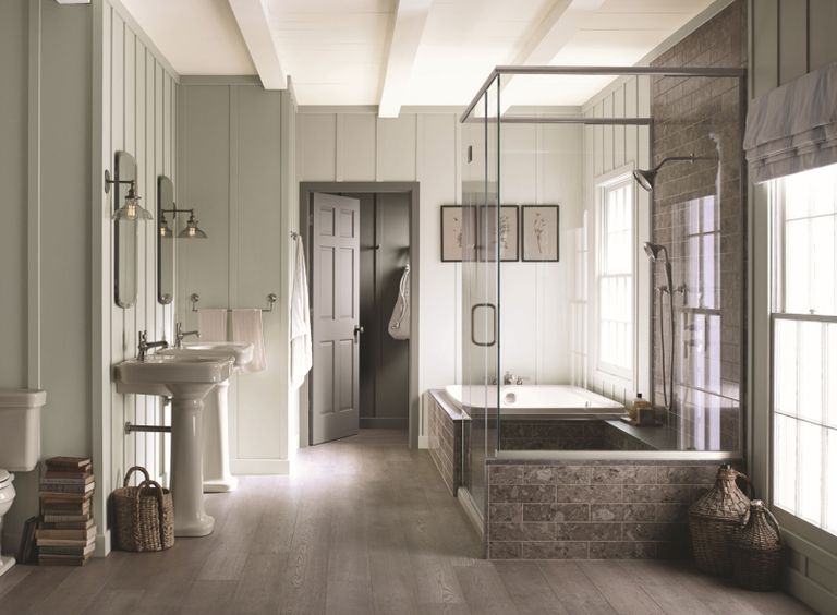 a modern bathroom with traditional paneled walls