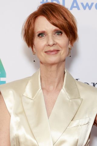 cynthia nixon with short hair styled in a pixie cut.