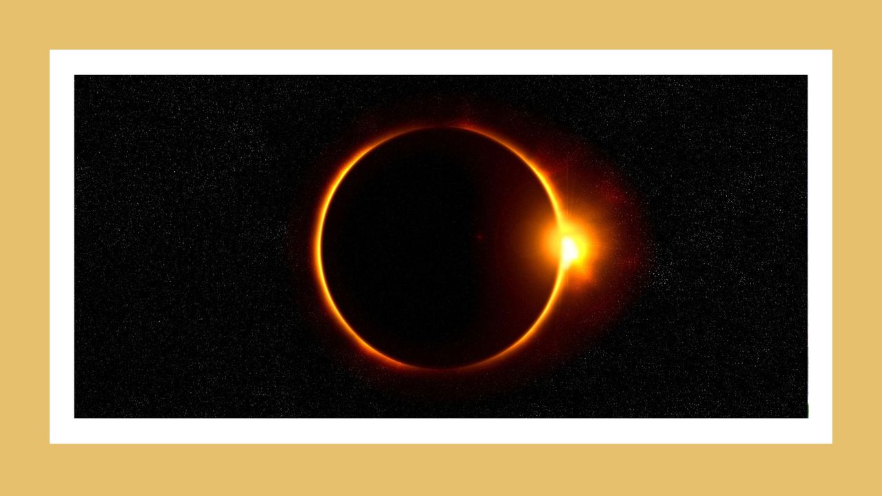 an eclipse on a yellow background representing the aries solar eclipse in april 2023