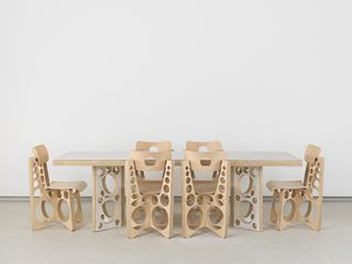 Table and chairs with cut-out design, by Tom Sachs