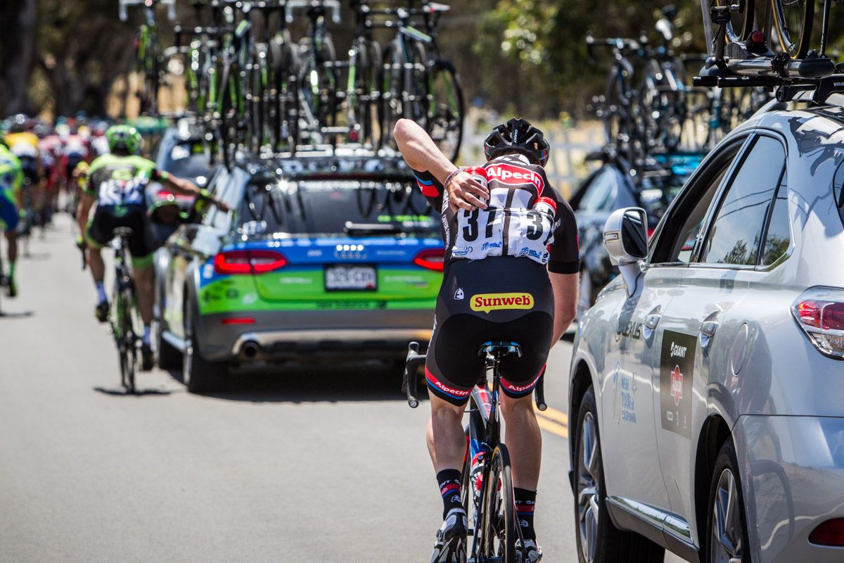 Riders drop back to the cars to feed