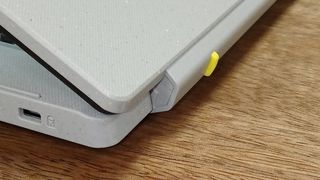 Acer Chromebook Vero 514 review; a close up of yellow details at the rear of a laptop