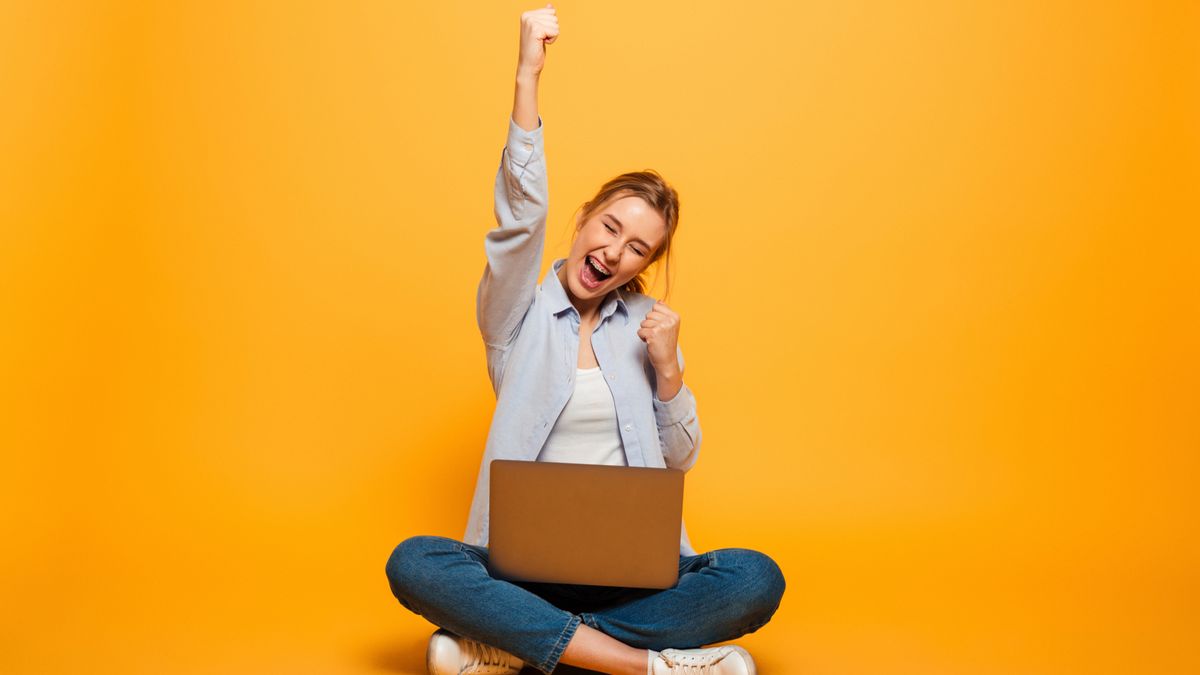 happy woman using a laptop