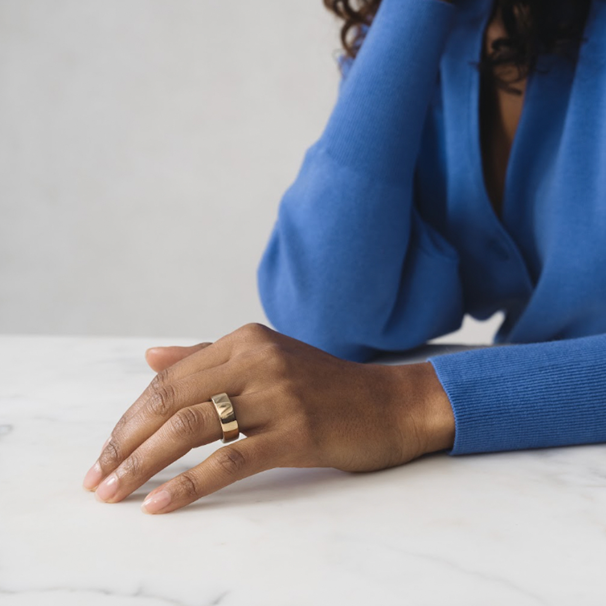 Woman wearing an Oura ring tracker