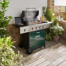 Green BBQ in a patio area