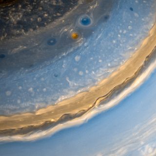 Saturn's whirling cloud formations look absolutely mesmerizing in this close-up view from NASA's Cassini spacecraft. Citizen scientist Kevin Gill created this false-color image using near-infrared data collected by Cassini on Feb. 27, 2013.