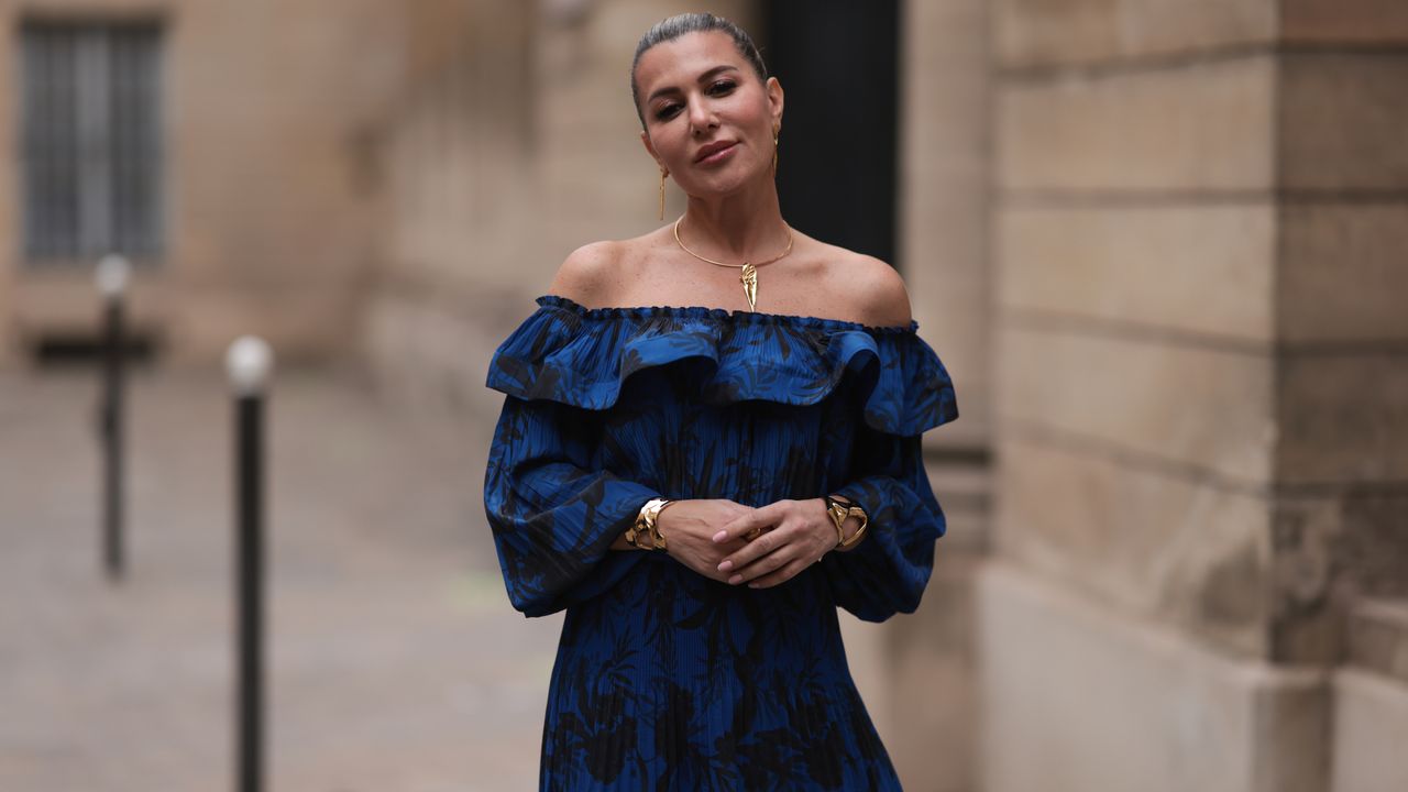 Best floral dresses:Olga Ferrara seen wearing Ungaro blue flower pattern off-shoulder pleated long dress, Amato gold jewerly, during Paris Fashion Week