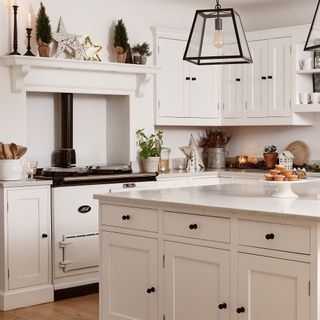 a white scandi-style kitchen with a large aga cooker