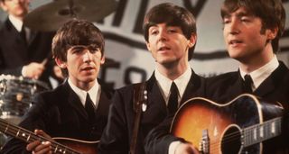 A close-up shot of the The Beatles performing