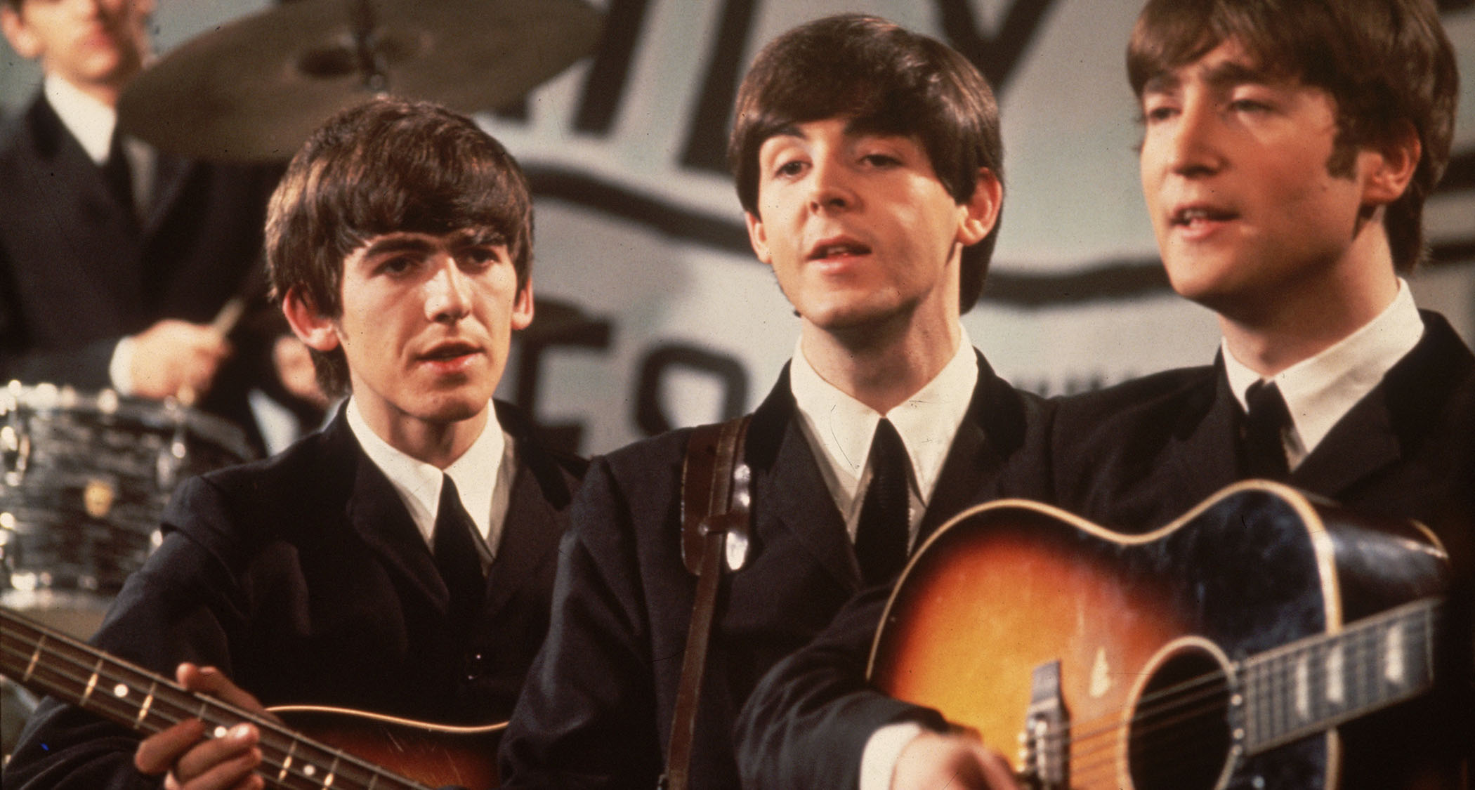 A close-up shot of the The Beatles performing