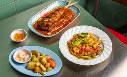 Dishes at Thai restaurant Speedboat Bar in London
