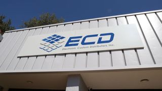 An outside look of the blue ECD logo for Electronic Custom Distributors (ECD) business in Austin.