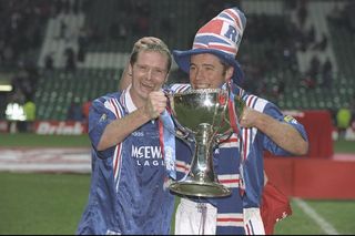: Paul Gascoigne (left) and teammate Ally McCoist pose with the trophy after the Scottish Coca Cola cup final between Rangers and Hearts at Celtic Park in Glasgow. Rangers won 4-3. Mandatory Credit: Mark Thompson/Allsport