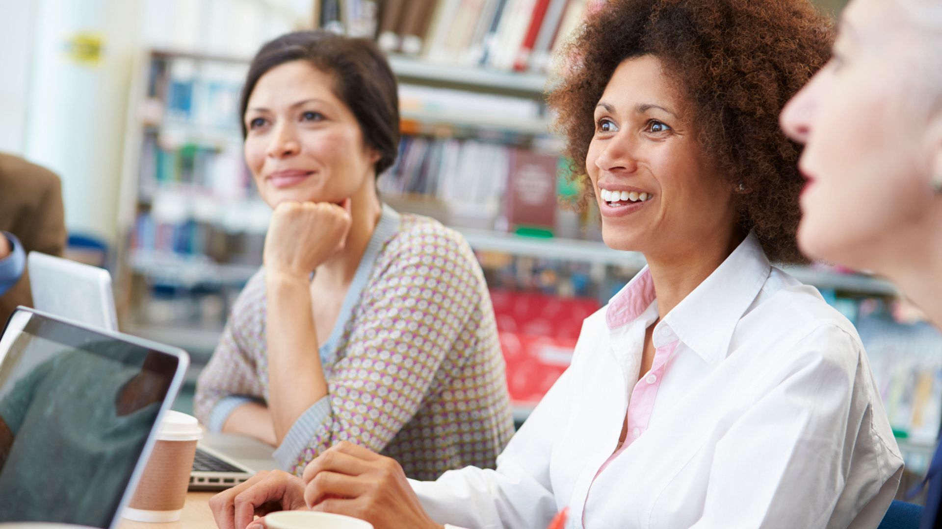 A group of women learning in a library