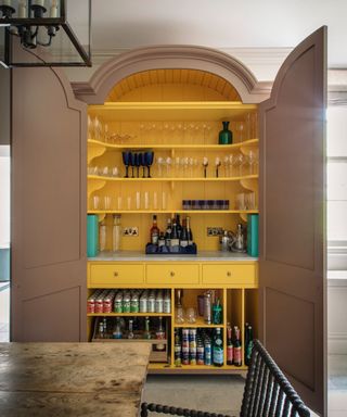 large home bar pantry cupboard with yellow interior