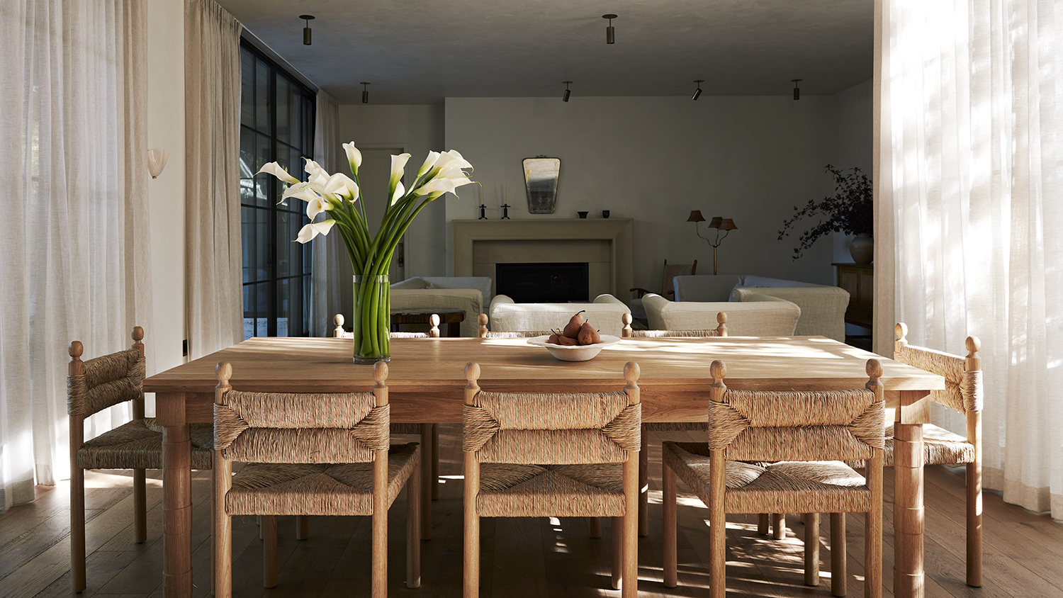 dining room with wood table and rattan chairs