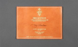 From Emilio Pucci came a piece of tan stiched leather with gold embossed lettering.