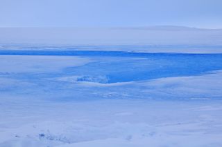 A moulin, or drainage passageway, inside the crater on the Roi Baudouin ice shelf in Antarctica. 