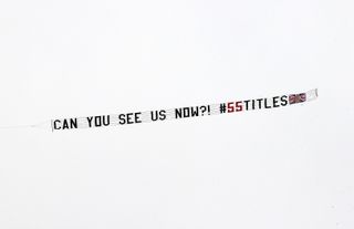 A plane flies over Dundee United's stadium with the message ‘Can You See Us Now?'