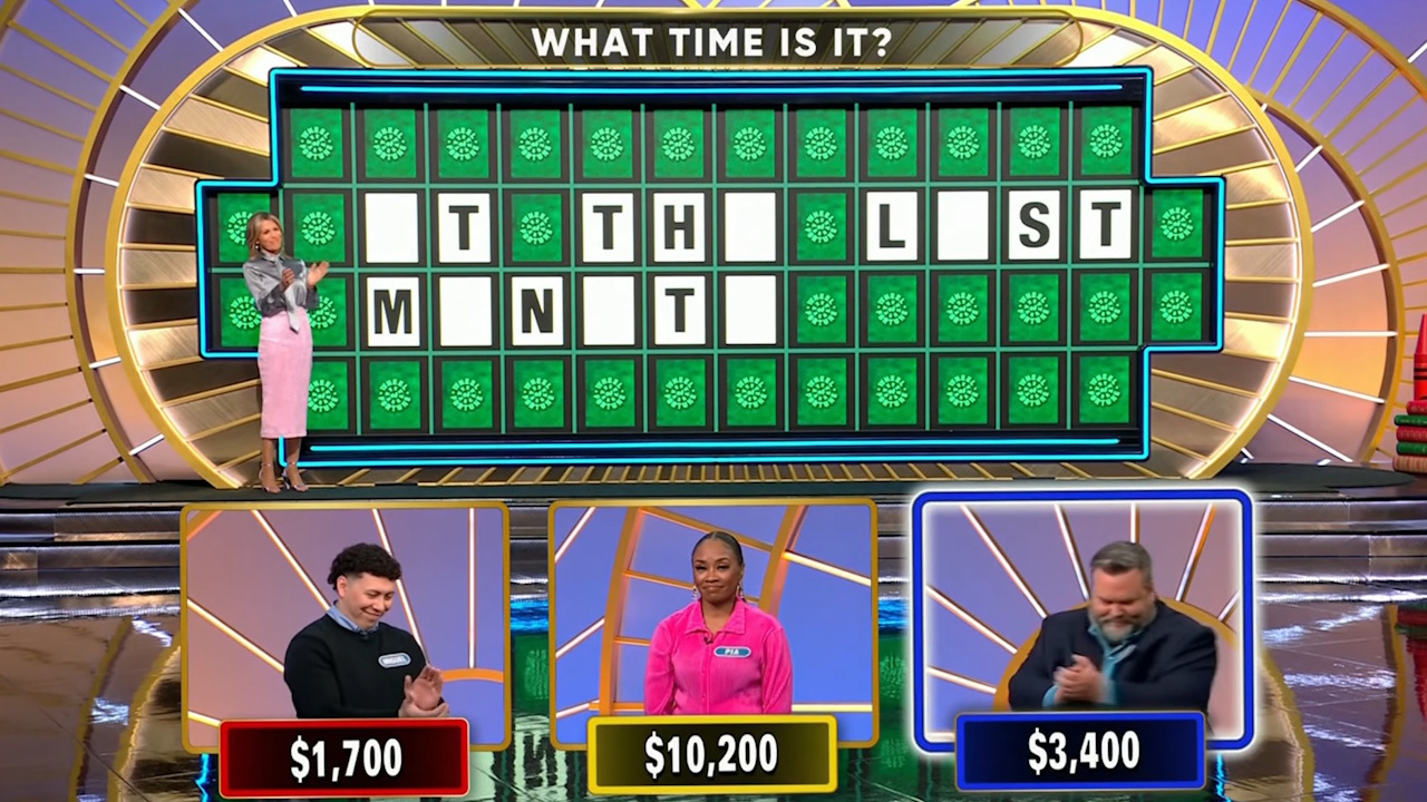 Contestant Pia Wilson (center) reacts to another contestant solving a puzzle after she was cut off when trying to do so on the September 16, 2025, episode of Wheel of Fortune.