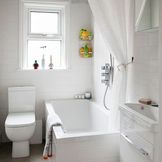 bathroom with bathtub and white metro tiles