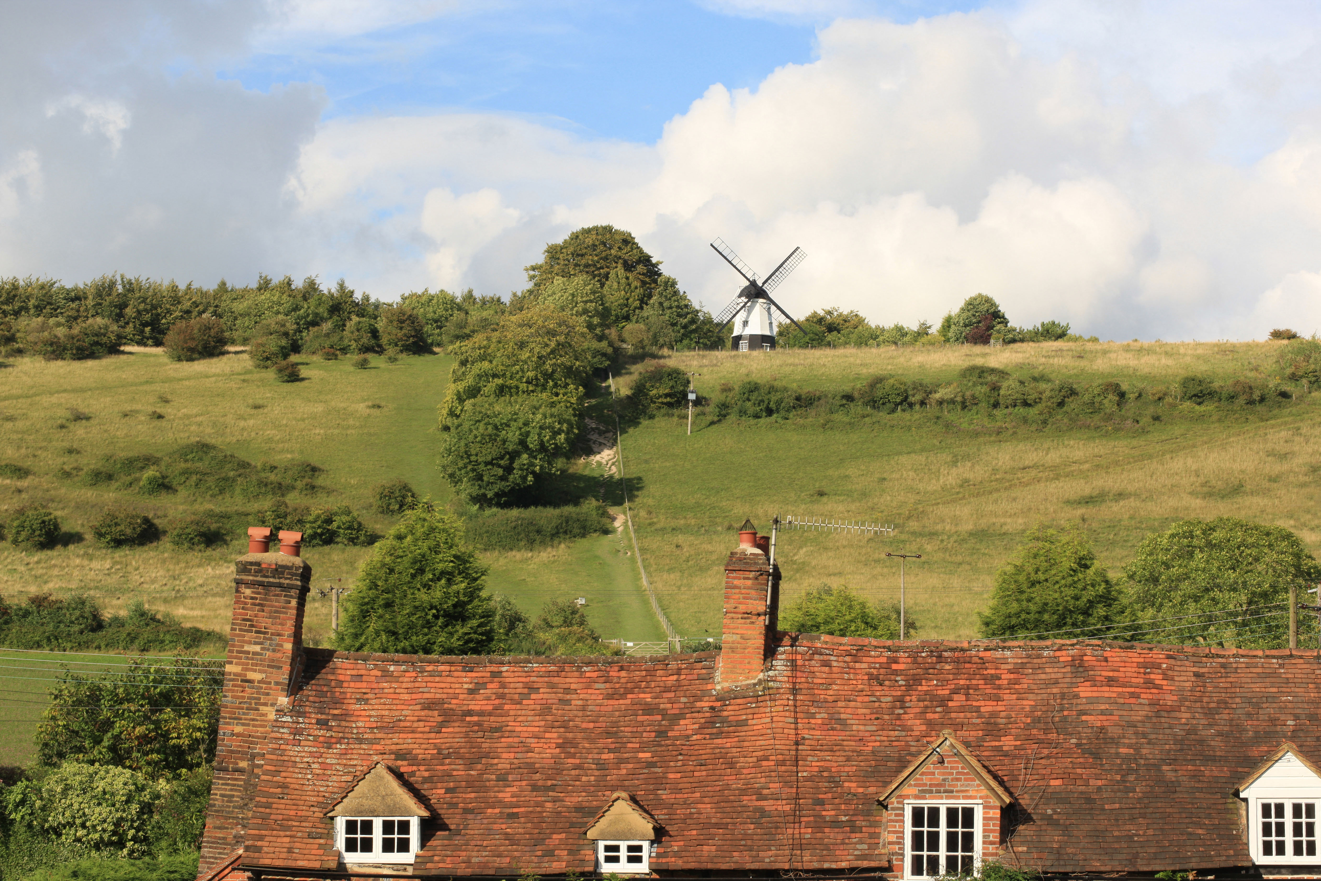 A view of Turville in Buckinghamshire with the windmill behind