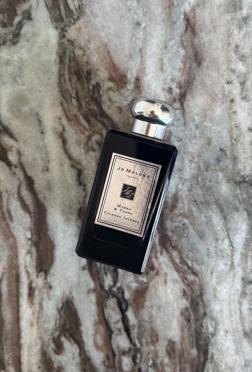 A photo of Jo Malone Myrhh &amp;amp; Tonka perfume on a marble table