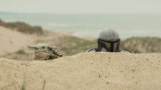 (L-R) Grogu and Mandalorian (Pedro Pascal) in Lucasfilm's THE MANDALORIAN & GROGU. Photo courtesy of Lucasfilm. &copy; 2025 Lucasfilm Ltd&trade;. All Rights Reserved.