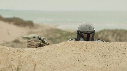 (L-R) Grogu and Mandalorian (Pedro Pascal) in Lucasfilm's THE MANDALORIAN & GROGU. Photo courtesy of Lucasfilm. &copy; 2025 Lucasfilm Ltd&trade;. All Rights Reserved.