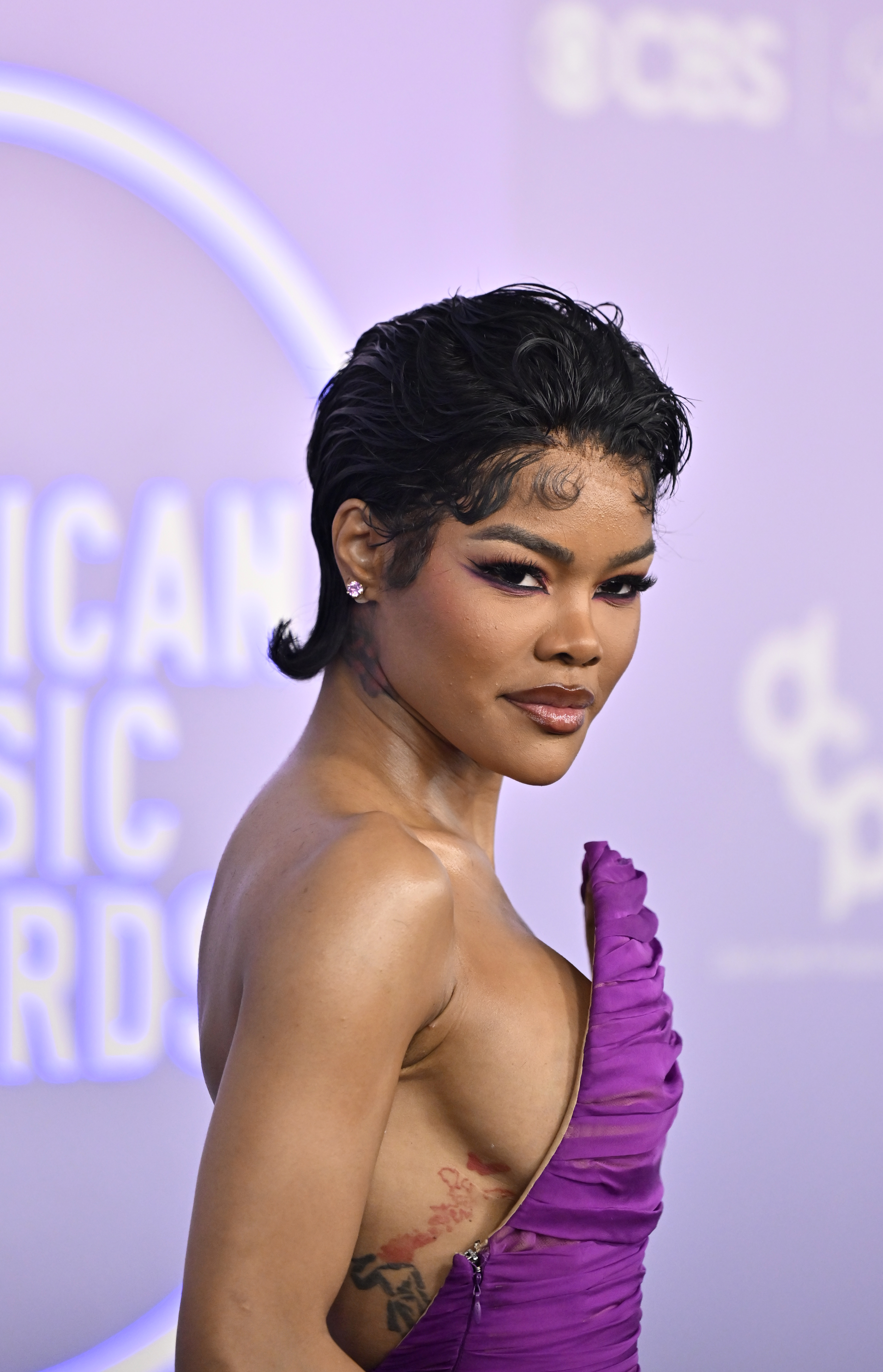 teyana taylor wears a purple gown at the 2026 american music awards
