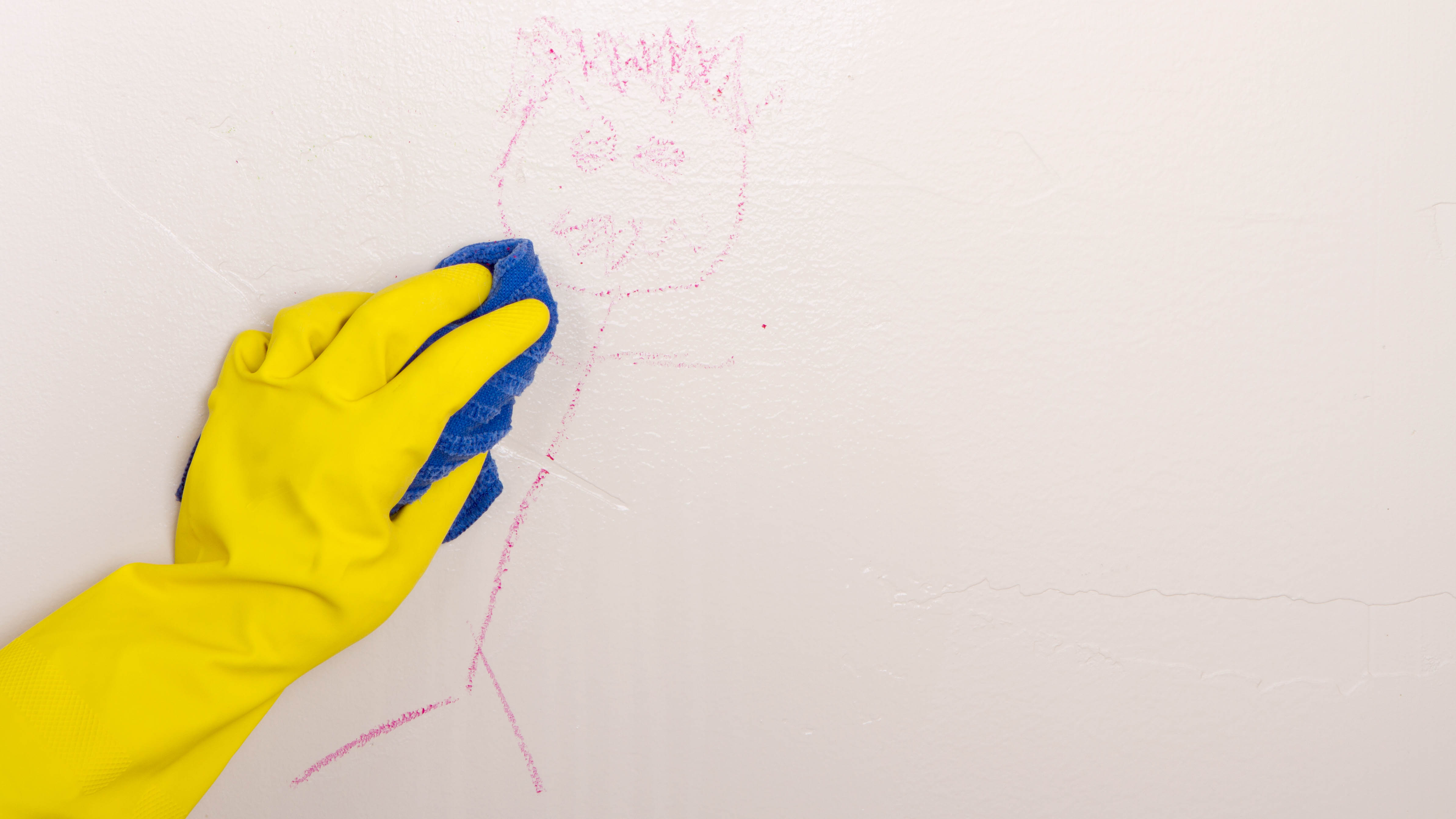 Cleaning crayon on wall