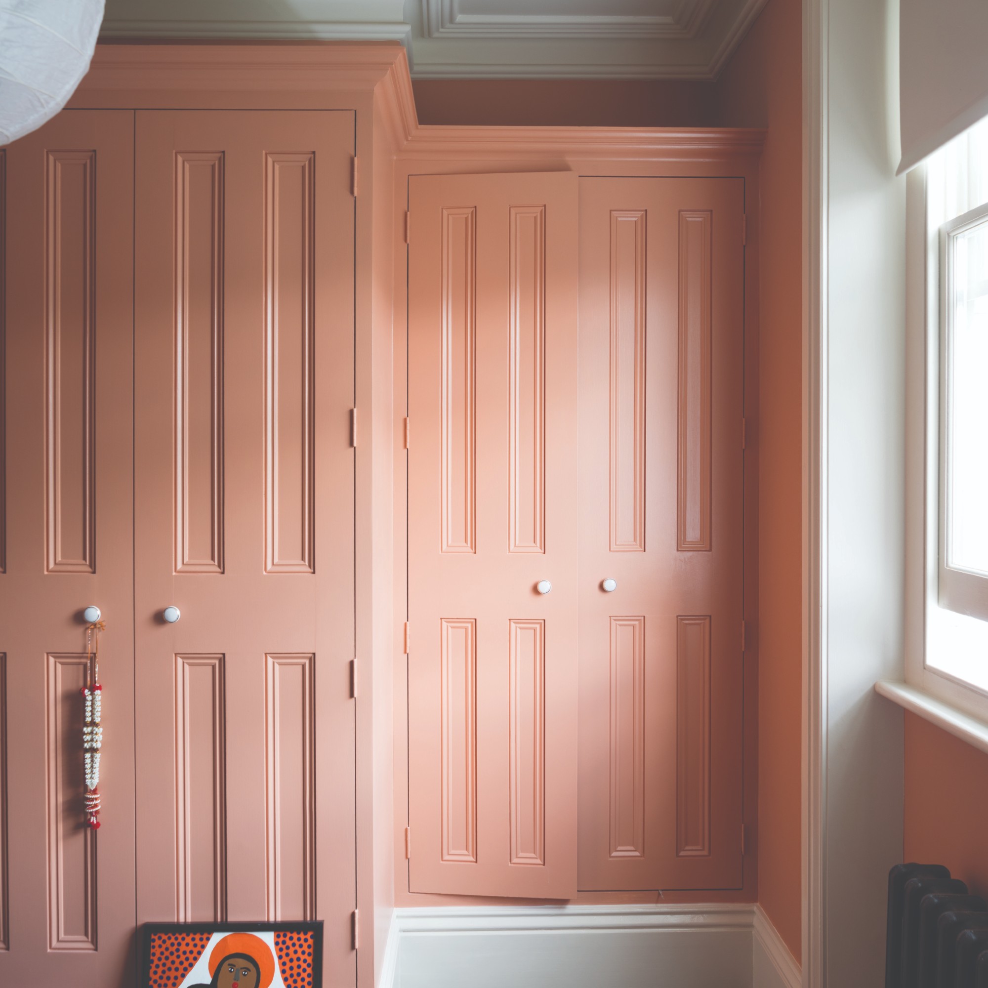 Build-in wardrobes painted in Farrow &amp;amp; Ball's Poryphyry Pink