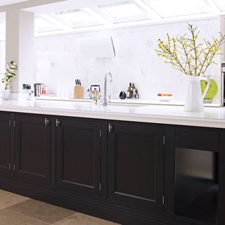 modern kitchen with black painted shaker style cabinetry