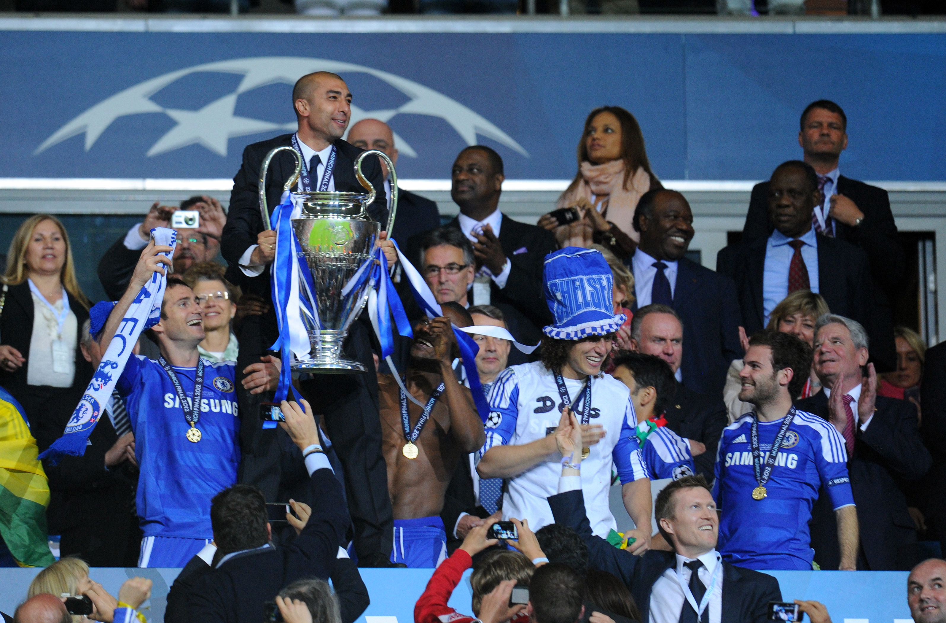 Roberto Di Matteo celebrates with the Champions League trophy after Chelsea's win over Bayern Munich in the 2012 final.