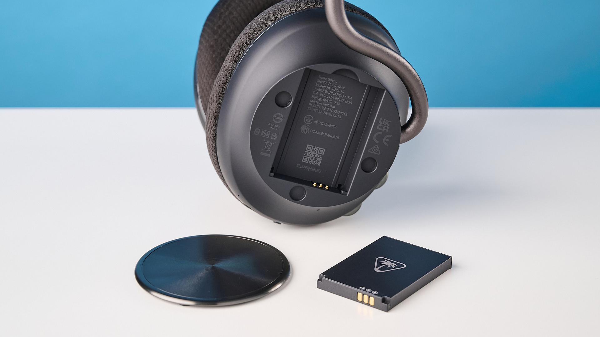 The Turtle Beach Stealth Pro II battery removed next to the open earcup