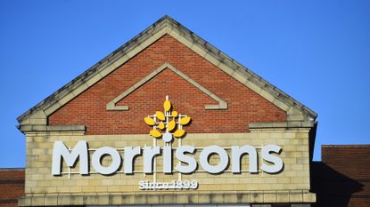 A logo of Supermarket company, Morrisons is seen outside one of its stores on November 13, 2020 in Newcastle-Under-Lyme, Staffordshire